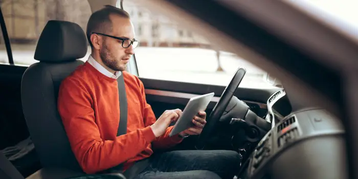 Driver comparing personalised auto insurance quotes from trusted partners on this site